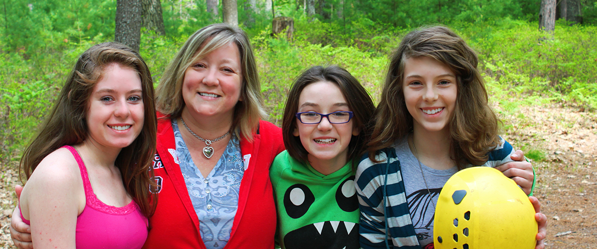 a mother and daughters at YMCA family camp