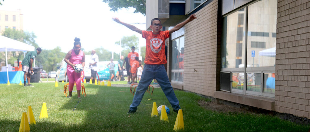 a child jumping during a YMCA SportPort game