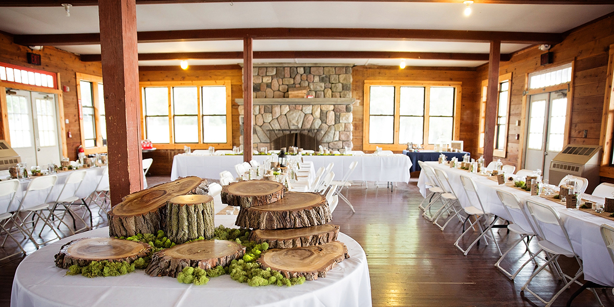 a wedding reception set up in the dining hall at YMCA Camp nissokone