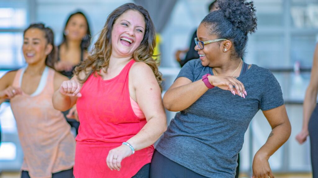 friends in a group exercise class having fun together at the Y