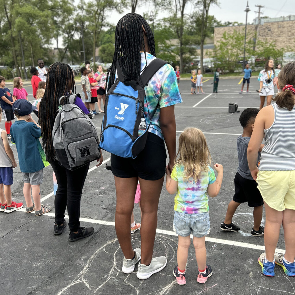 Summer Day Camp Counselor with young camper