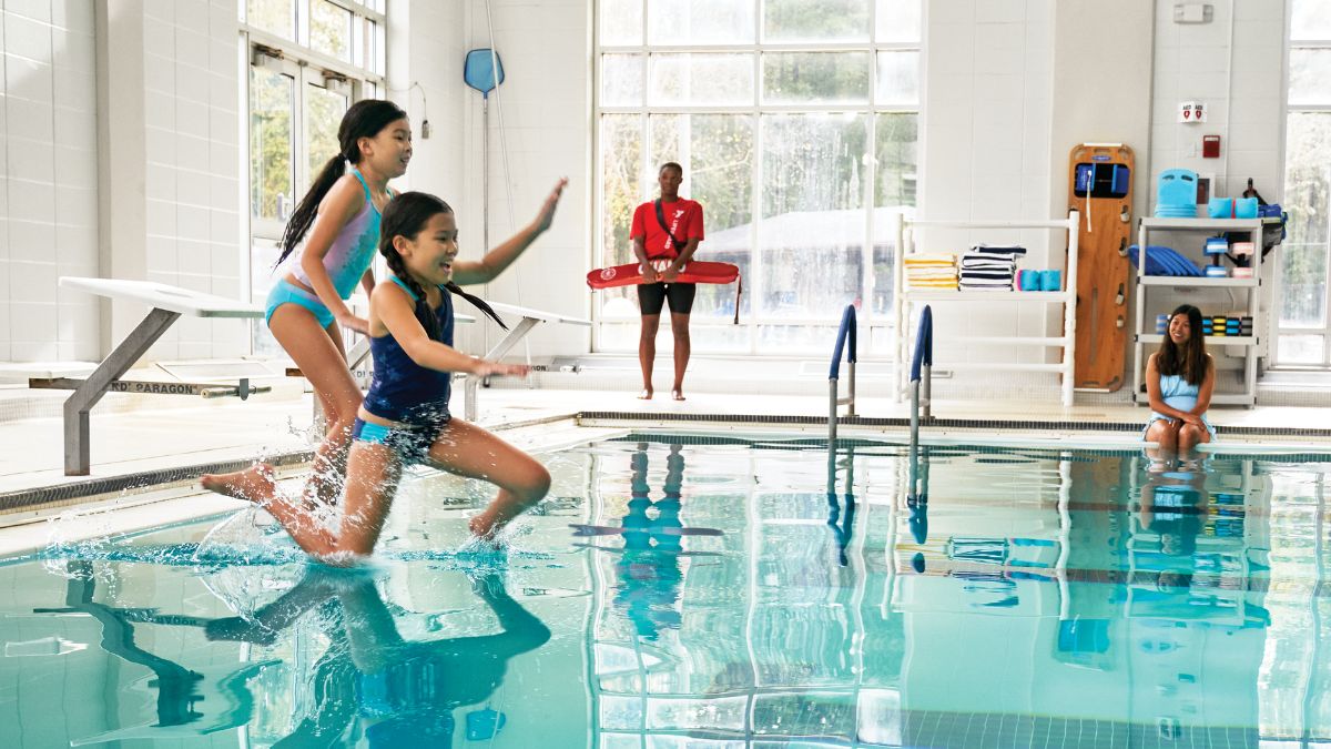 two child jump into pool while lifeguard is present