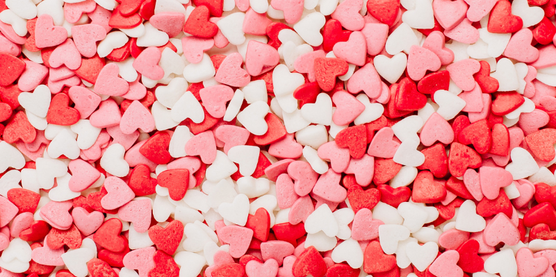 a pile of heart shaped candy