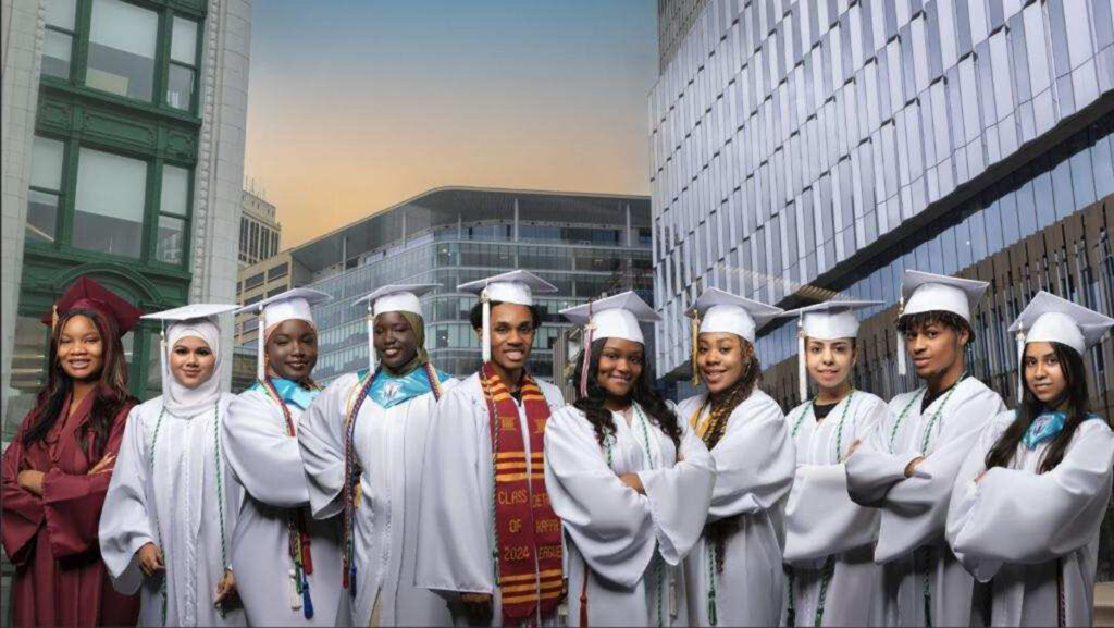 2024 Achievers graduates posing in caps and gowns