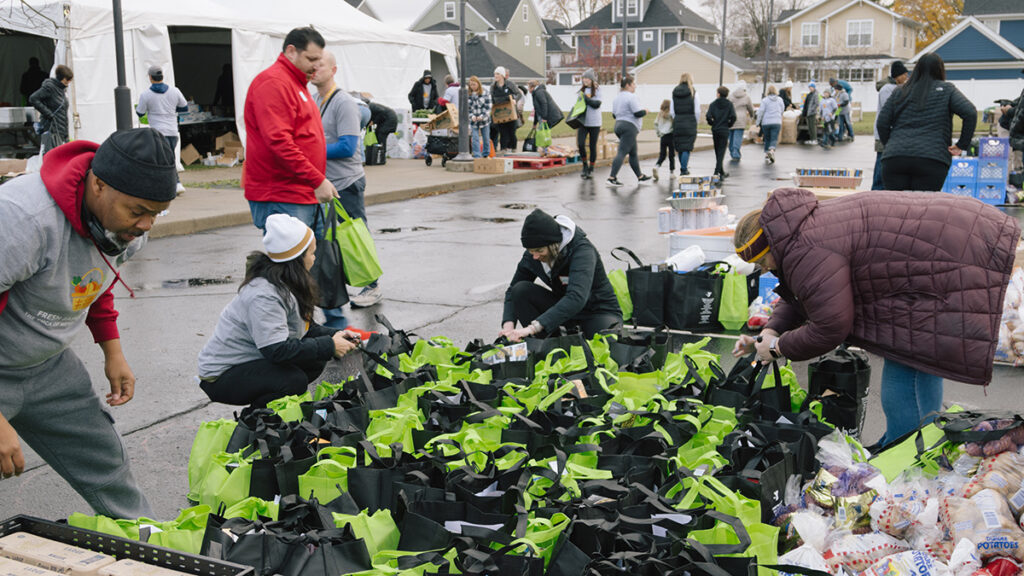 volunteers packing healthy meals for YMCA Fresh baskets